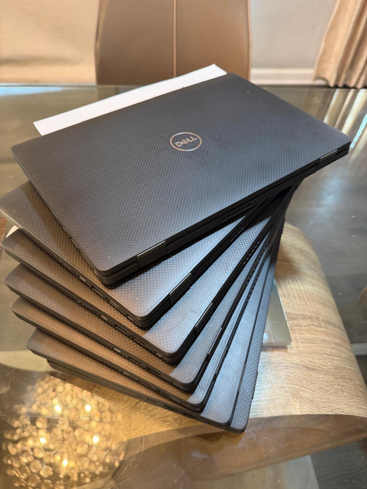 Refurbished Dell Latitude 7420 — stack of units
